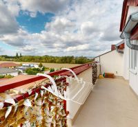 A balcony with a view of greenery on Družstevná Street, Hamuliakovo, 4-room apartment.