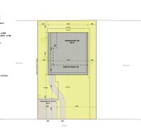 Floor plan of a family house in Častkovce with a terrace and green areas.