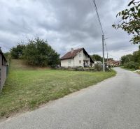 Residential house and street in the suburbs of Medzianky, residential plots with lawns.