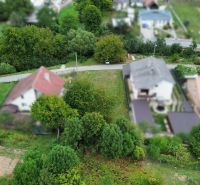 An aerial view of residential plots surrounded by greenery in Medzianky.