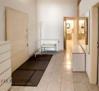 Entrance hallway in a 2-room apartment with tiles and a mirrored wall.