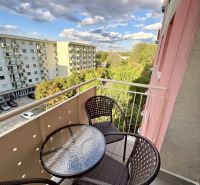A balcony in a 3-room apartment on Šustekova Street in Bratislava-Petržalka with a view of greenery.