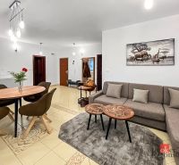 Living room in a 3-room apartment with a comfortable sofa and a decorative painting on the wall.