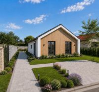 A family house on Veľká Mača Street in Veľká Mača with a landscaped garden and walkway.
