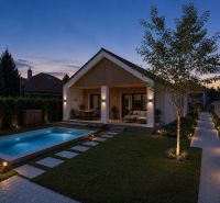 A family house in Veľká Mača in Veľká Mača with a pool at sunset.