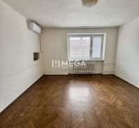 A room in a 3-room apartment with a wood-decor floor and air conditioning.