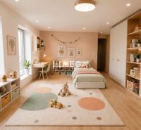 Children's room with a carpet, toys, and a wooden decor floor in a family house.