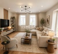 Living room in a family house with a large sofa and a wooden decor floor.