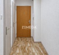 The entrance hall of a 2-room apartment with a marble-patterned floor and white walls.