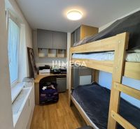 Bunk bed, work desk, and floor with wooden decor in a 3-room apartment.