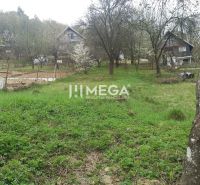 Gardens in Humenné with cottages and trees, suitable for cultivation and relaxation.