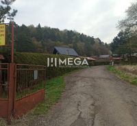 The path leading to the gardens in Humenné lined with trees and fences with a no entry sign.