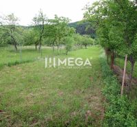 Land for residential use in Ptičí, Ptičí, with grassy area and trees, fenced.