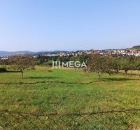 Residential land in Humenné, with a view of the city skyline and greenery.