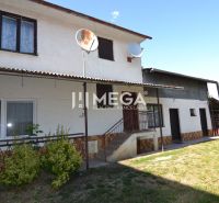 A family house in Hažín nad Cirochou with a yard and a white facade on Hažín nad Cirochou street.