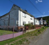 A family house on a street in Hažín nad Cirochou with a garden and a gate.