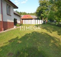 A family house in Vyšné Ladičkovce on Vyšné Ladičkovce Street with a spacious garden and trees.