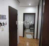 Entrance hallway with a key hanger in a 3-room apartment, floor with wood decor.