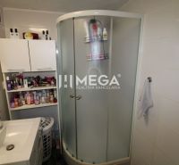 Bathroom in a 3-room apartment with a shower, mirror, and storage space.