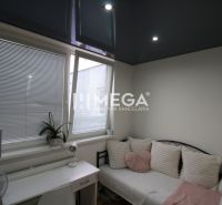A cozy corner with white pillows and a desk in a 3-room apartment.