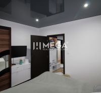 Bedroom in a 3-room apartment with a dark wardrobe and a TV on the wall.