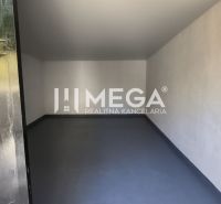 Interior in a 4-room apartment with white walls and gray flooring.