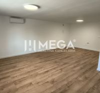 Interior of a 4-room apartment with a wooden decor floor and white walls.