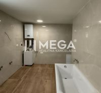 A bathroom with light tiles, a bathtub, and a floor with a wood decor in a 4-room apartment.
