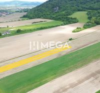 Hilly landscape near Jasenov with residential plots, surrounded by fields and forests.