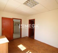 Office space with wood-patterned flooring and built-in ceiling lighting.