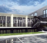 Commercial premises in Humenné on Poľná Street with glass facades and parking.