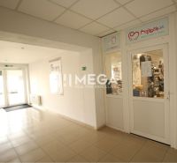 Commercial premises with tiles and glass doors, in a bright interior.