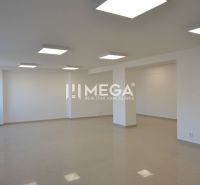 Bright commercial spaces with ceramic flooring and ceiling lighting in Humenné.