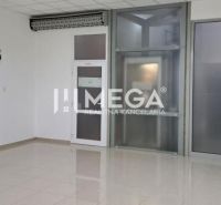 Spacious offices with ceramic flooring, glass doors, white walls, air conditioning.