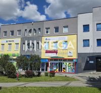Commercial spaces on Freedom Square in Humenné, modern facades and display windows.