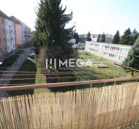 The balcony of a 2-room apartment on Sokolovská Street in Humenné with a view of greenery and a playground.
