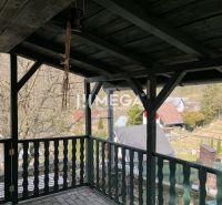 Covered terrace with a view of the gardens in Humenné, ZO Poniklec, features wooden decor.