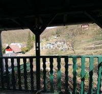 View from the garden in ZO Poniklec, Humenné, with rural houses and nature.