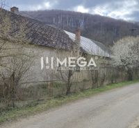 A family house on Čabiny Street in Čabiny surrounded by blooming trees and nature.