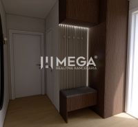 An entrance hall with a wooden decor floor, a mirror, and a bench in a family house.