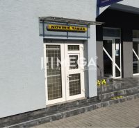 Commercial premises on Osloboditeľov Street in Humenné with entrance doors and a signboard.