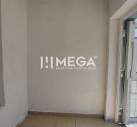 Commercial premises with a wooden decor floor and an exterior view of Osloboditeľov Street in Humenné.