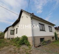 A family house on Brestovska Street in Humenne surrounded by greenery and a paved courtyard.