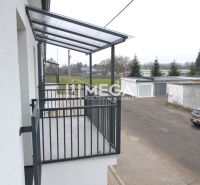 A balcony in a 2-room apartment on Pod hradom street in the town of Strážske with a view of the garages.