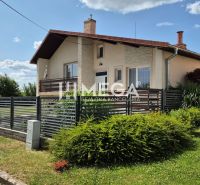 A family house on Budovateľská Street in Humenné with a front garden and a modern fence.