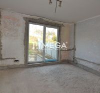 Interior renovation in a family house, unattractive walls, large window to the exterior.