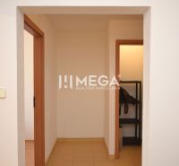 Interior of a 2-room apartment with white walls and tiles.