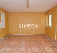 Commercial space with wooden wall decor and a window provides a bright interior.