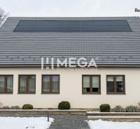 Commercial premises in Zboj with photovoltaics on the roof and a snowy environment.
