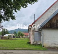 Commercial premises in Zboj with a grassy plot, building with wooden cladding.